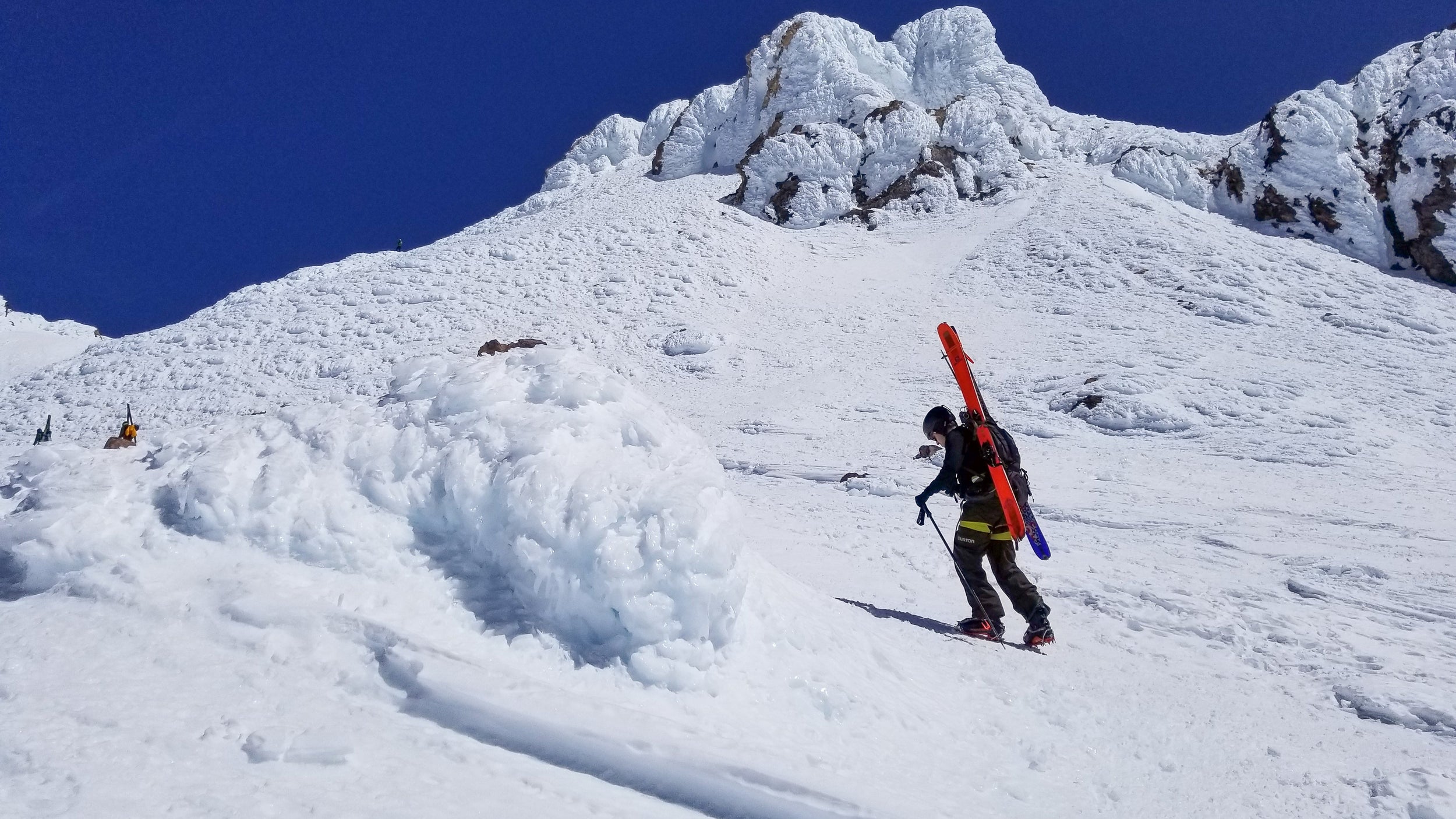 Skier hiking on Mt Shasta during a Blackbird Guides Summit & Ski 2 Day trip