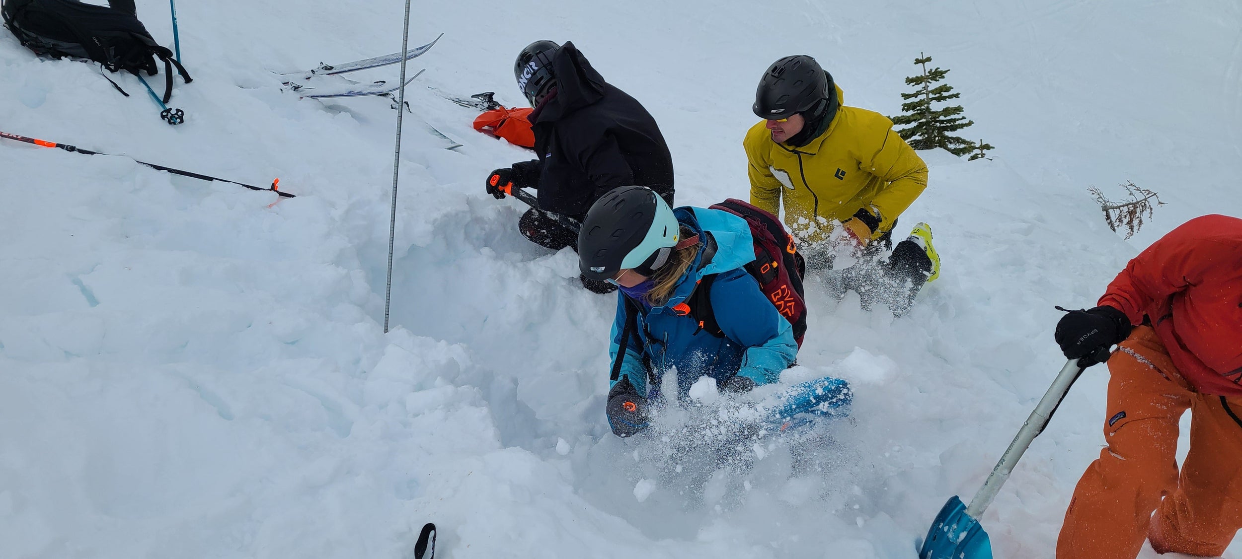 Students practicing rescue drills during an AIARE 1 +Rescue Avalanche course in Tahoe. A beacon is buried to simulate a burial victim.