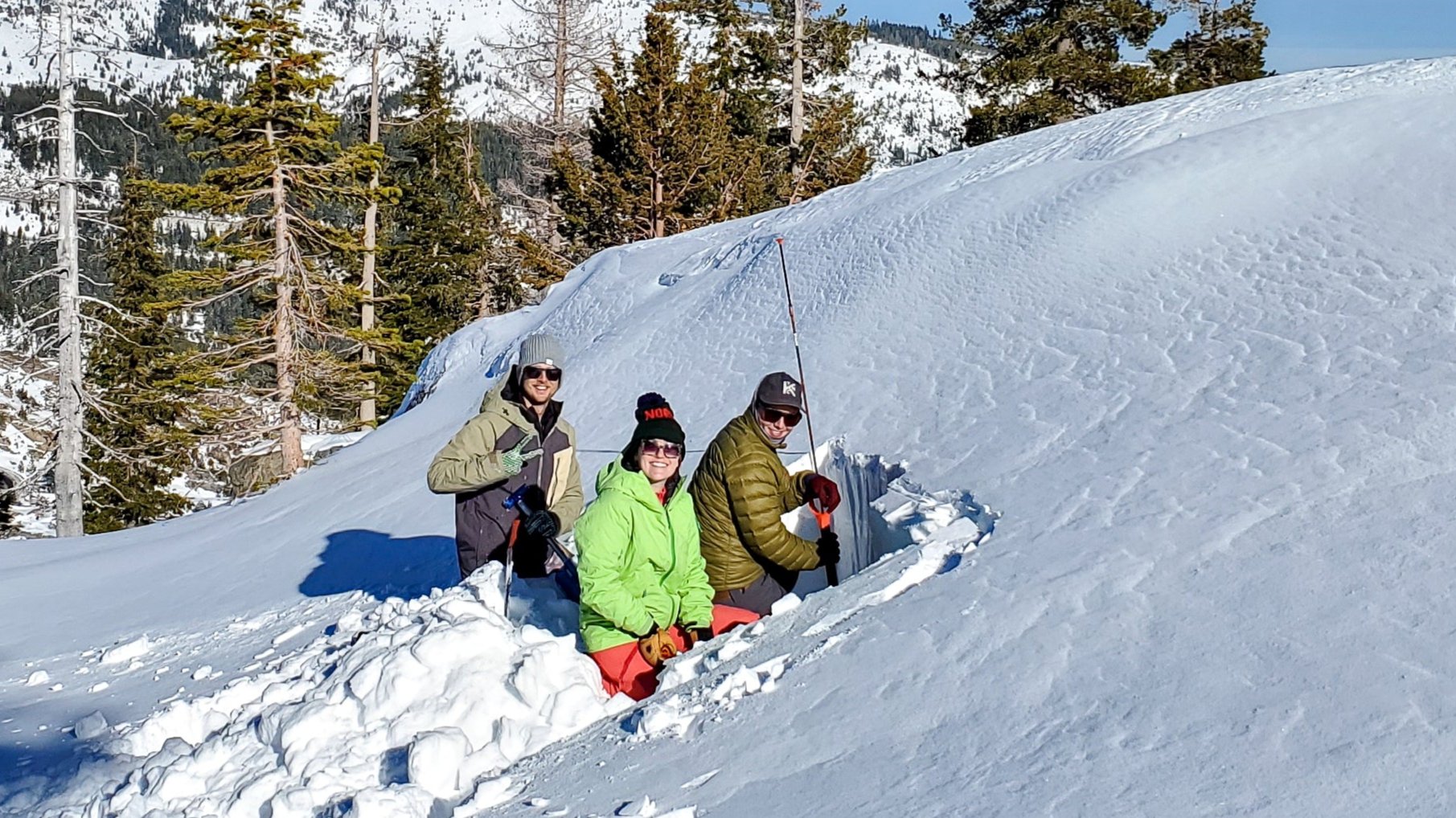 Students during an AIARE 1 Avalanche course in Lake Tahoe, digging snow pits to inspect the snowpack and layering.