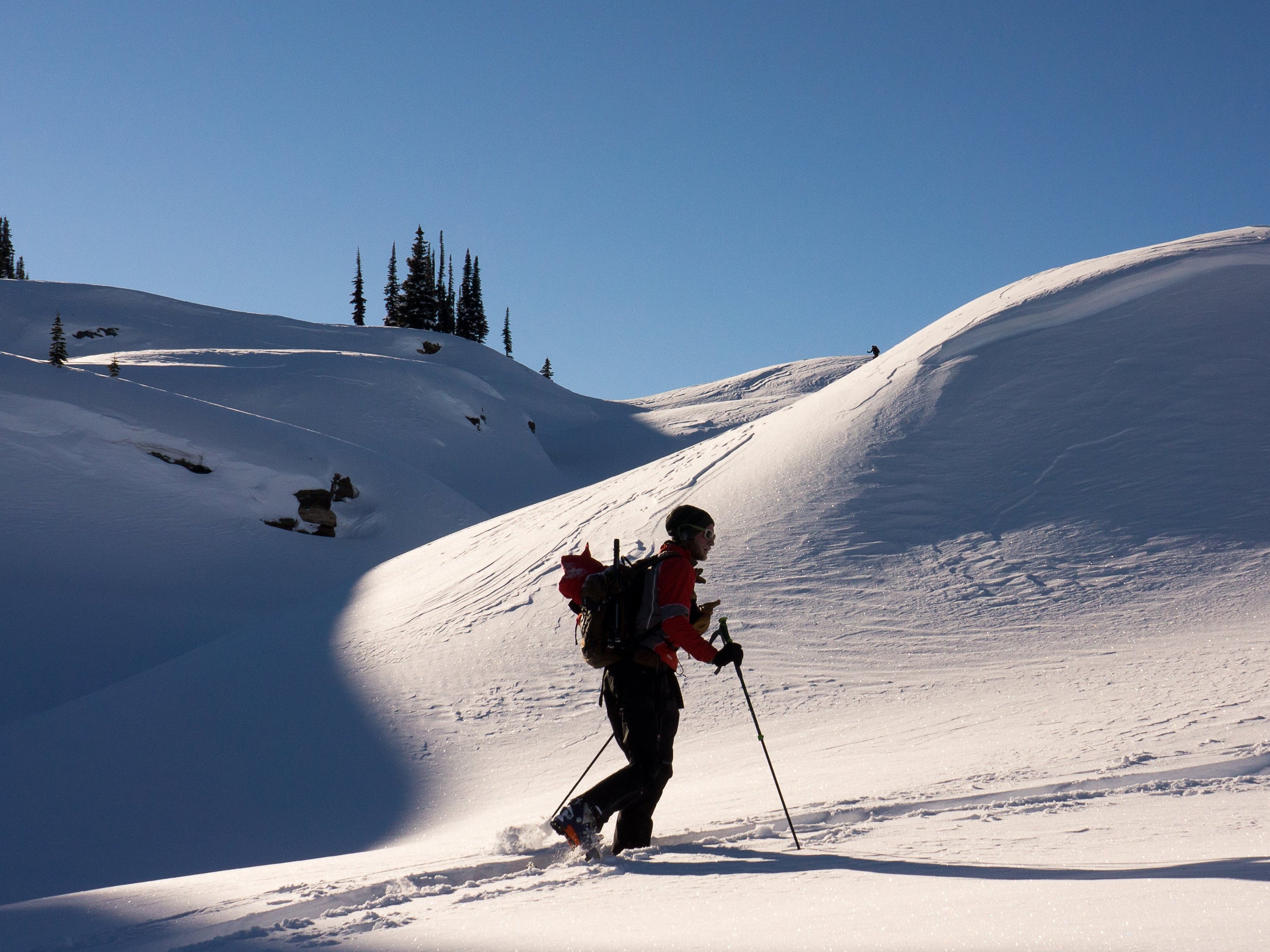 Skier touring during an AIARE 2 avalanche course with Blackbird Guides in North Lake Tahoe