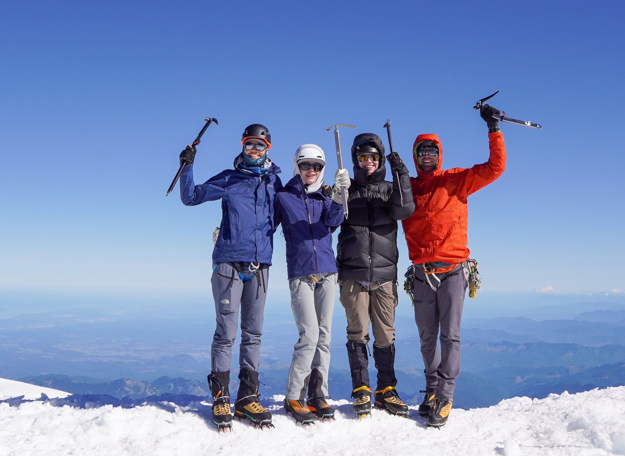 A Blackbird Mountain Guides team on the Summit of Mount Rainier on our Rainier Summit and Skills Expedition