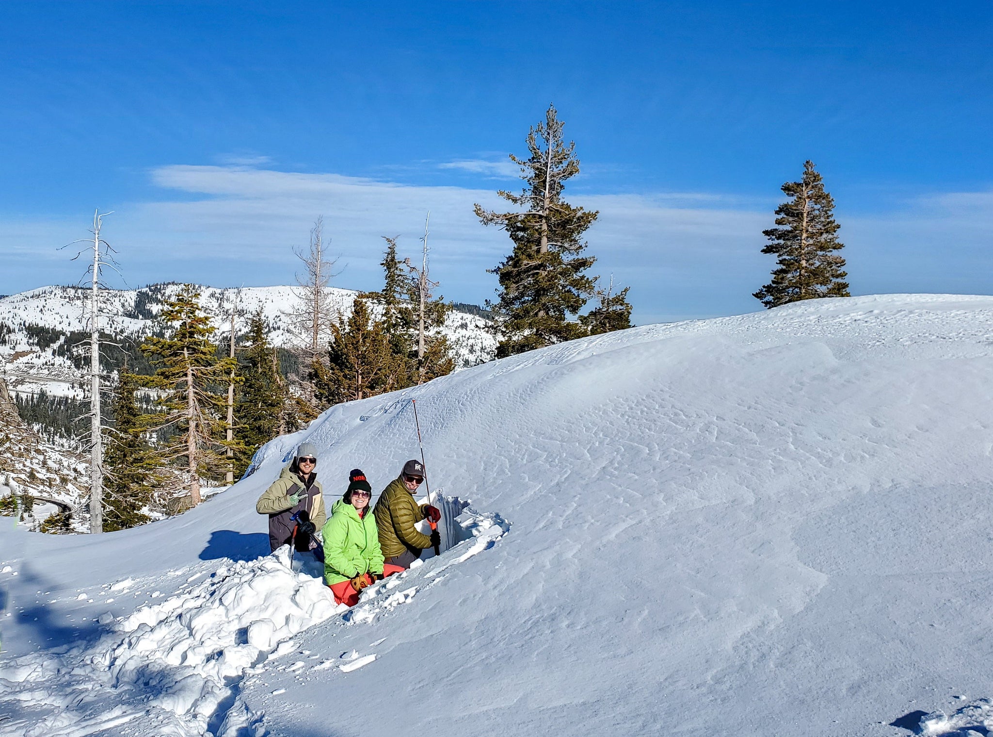 Participants performing a snowpack test during and AIARE avalanche course in Truckee California.