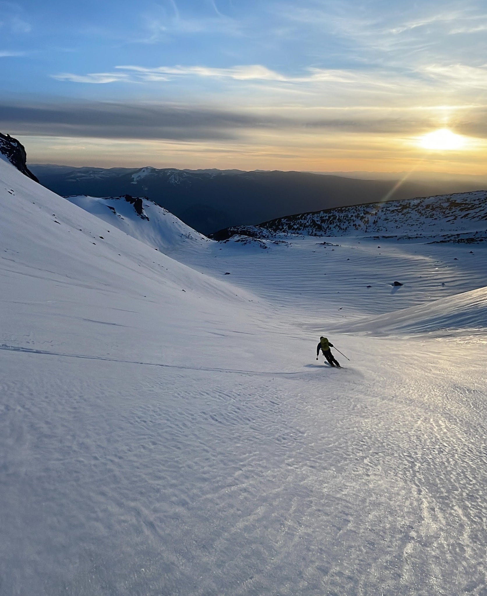 Ski mountaineering on Mt. Shasta using ice axe and crampons