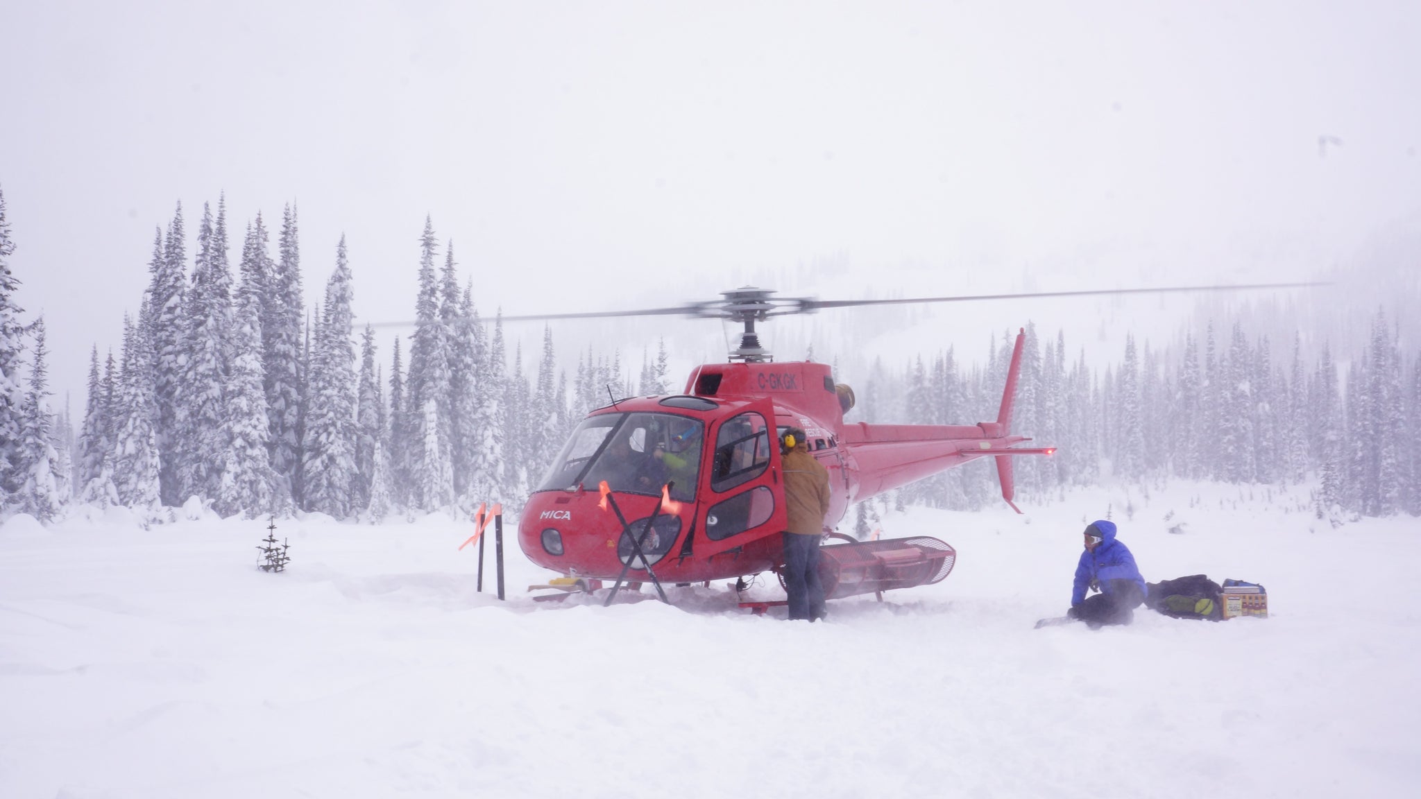A helicopter drops off skiers, riders food and gear at a British Columbia Ski Lodge during a Blackbird Mountain Guides Trip.