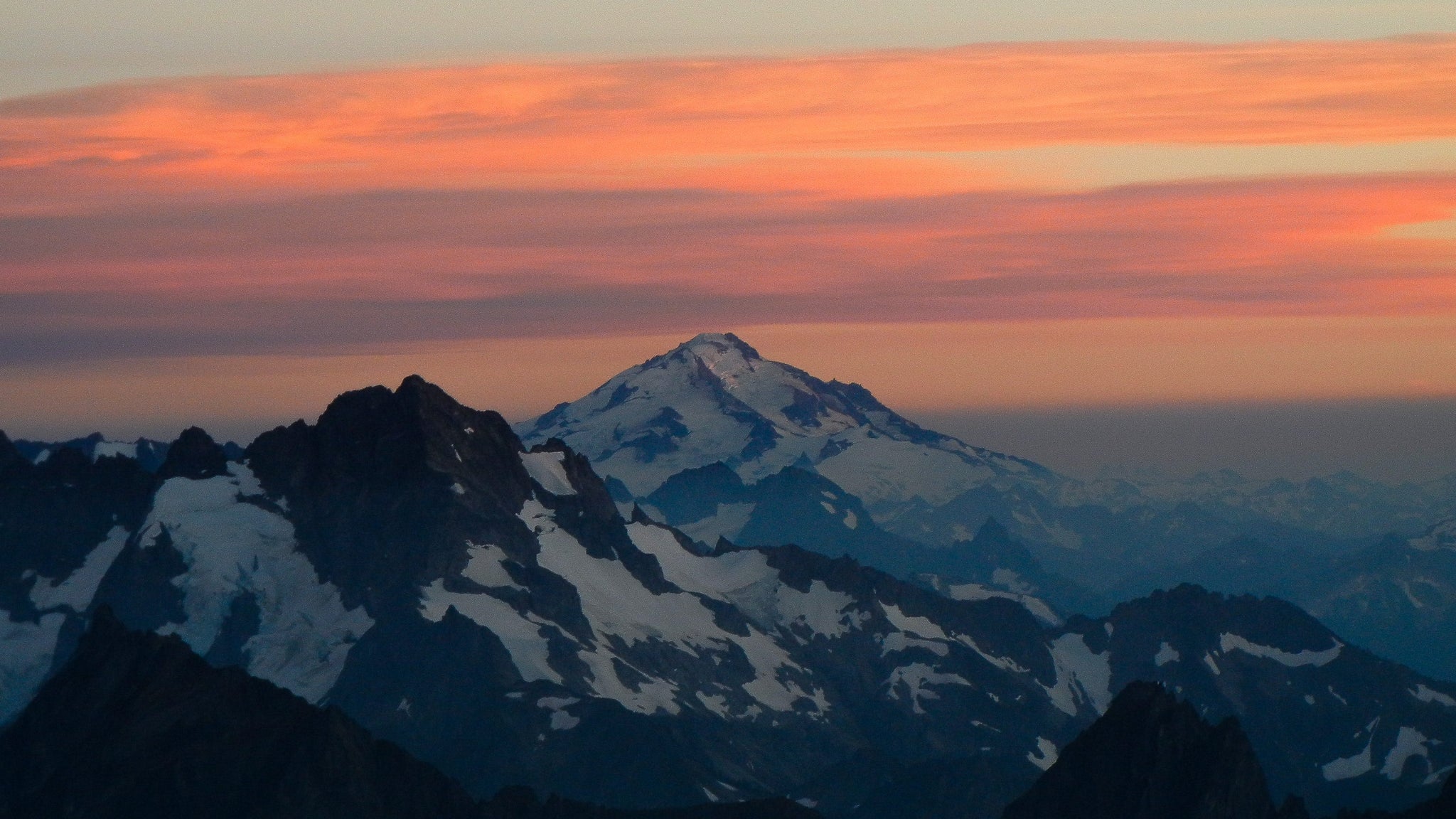 views from the west ridge of forbidden peak and boston basin at sunset