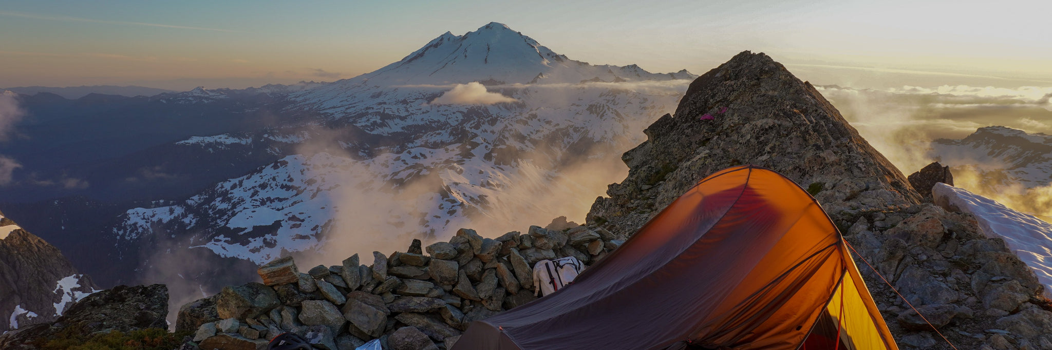 Sunset view of Mount Baker at Winnie's Slide Bivy on the Fisher Chimneys Route of Mount Shuksan