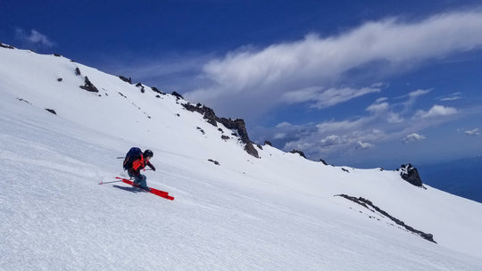 Skier making a turn on Mt Shasta in California
