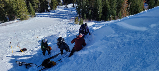 Rescuers performing an avalanche rescue during the Blackbird Lift Accessed AIARE Avalanche Rescue Course at Donner Ski Ranch
