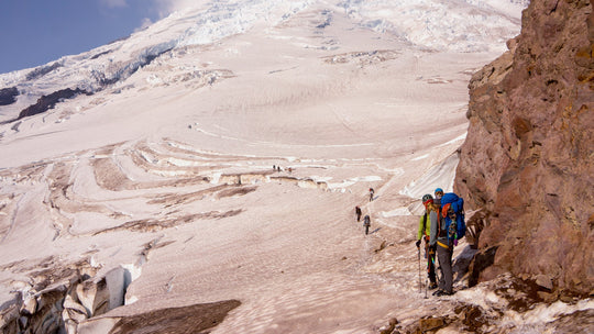Mountaineers climbing on a glacier on Mt Rainier in Washington