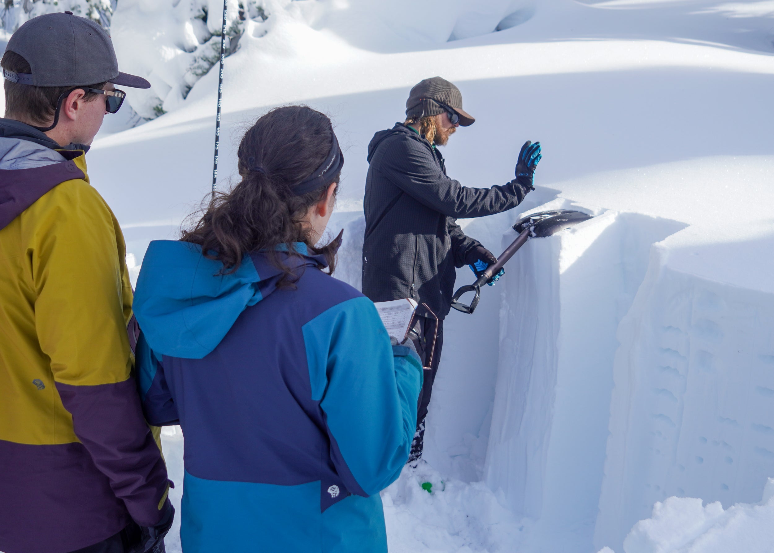 Blackbird instructor demonstrating snow pit shear test during an AIARE 1 Avalanche course 