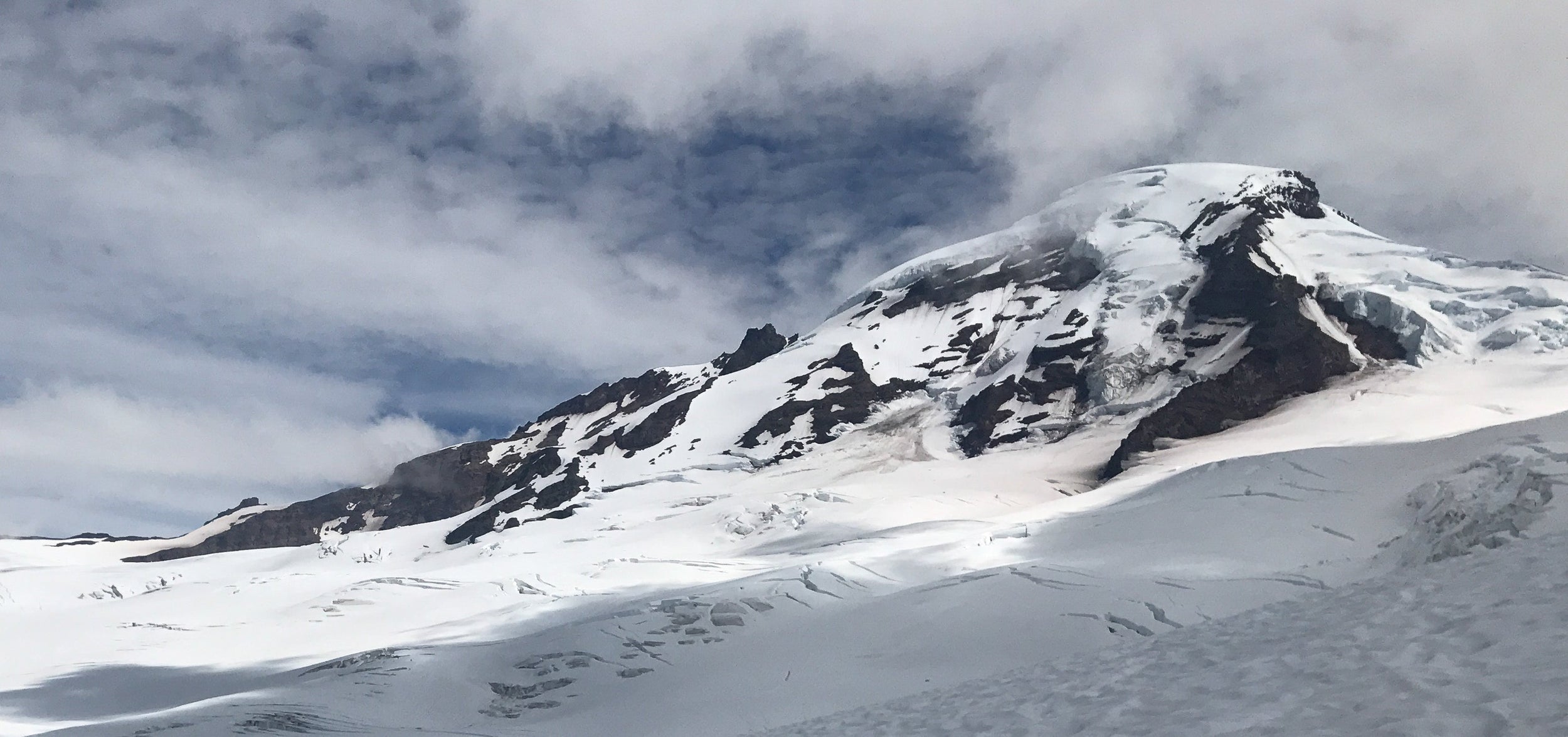 Crevasses in front of Mt Baker in Washington during a Blackbird Guides 4 day mountaineering skills seminar