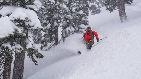 A skier rips a turn on deep day in the Tahoe backcountry.